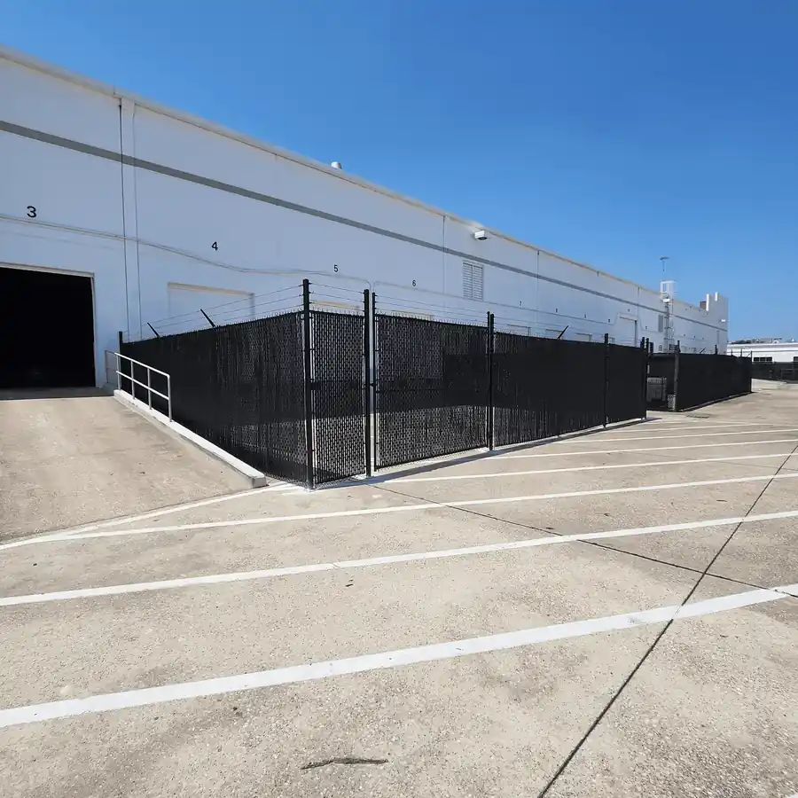 Black vinyl chain link fence by Griffin Fence