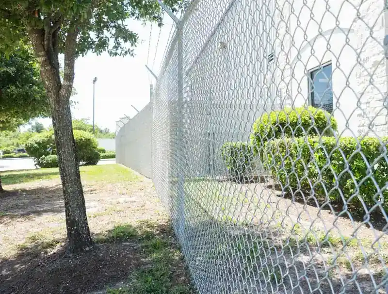 Chain Link Fence with Barbed Wire by Griffin Fence in Houston, TX